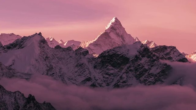 Greatness of nature: grandiose view of Ama Dablam peak (6812 m) at sunset. Nepal, Himalayan mountains. Time lapse zoom.