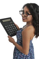 Woman using oversized calculator