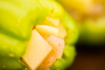 Green paprica filled by potatos and chicken breast pieces