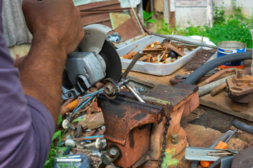 independent tool making using a vise and angle grinder, hands of a wizard, work with hands