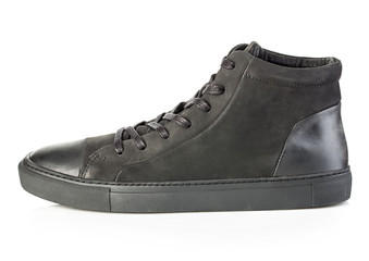 Side profile of black sneaker close-up isolated on a white background.