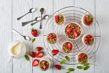 granola with yogurt in glass jars