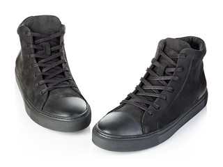 Pair of new black sneakers isolated on white background