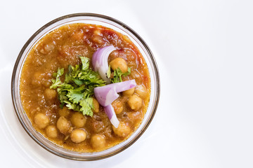 Delicious Chole Bhature ( spicy white Chick Peas) Indian Punjabi Cuisine served in Glass bowl in India