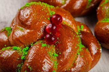 Ruddy fresh beautiful buns on a wooden background.