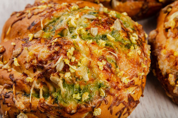 Ruddy fresh beautiful buns on a wooden background.