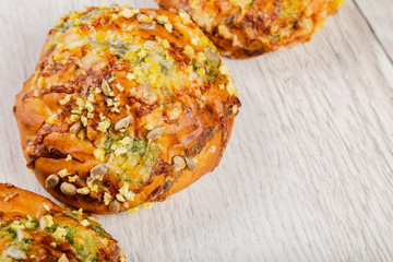 Ruddy fresh beautiful buns on a wooden background.
