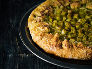 pie with a pieplant on a dark background