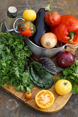 Fresh red pepper , eggplant and onion in pot with tomato, parsley,  coriander mangold