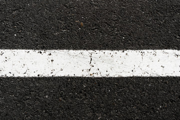 Asphalt road texture with white stripe. Road marking. Urban background