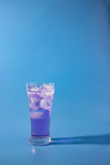 cocktail on blue background vertical.
