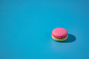 Macaron on cyan background.
