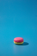 Macaron on cyan background.
