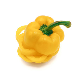 Fresh yellow vegetables sweet peppers on white background.