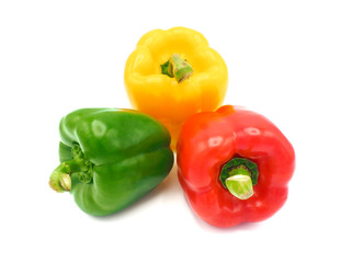 Fresh vegetables, red, yellow, green sweet peppers on white background.