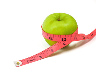 Measuring tape and fresh green apple on white background. Healthy food and lifestyle concept.