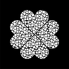 Four leaf clover icon on dark background