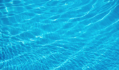 Fototapeta na wymiar Water in the pool as a background. Abstract composition of a water