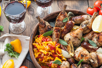 Peperonata with roasted chicken, close view, rustic style.