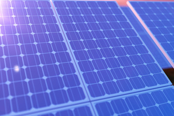 3D rendering solar power generation technology. Alternative energy. Solar battery panel modules with scenic sunset with blue sky with sun light.
