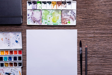 Top view of Art supplies on the wooden table