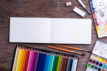 Top view of Art supplies on the wooden table