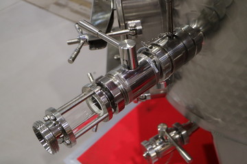 The valve on the container for storage of food liquids.