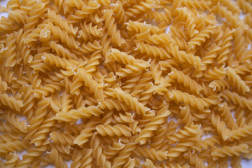 Raw fusilli pasta pattern background