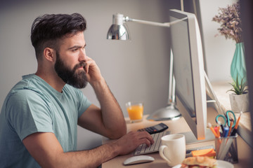 Busy man working at home
