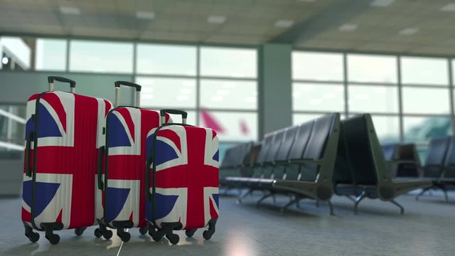Travel suitcases featuring flag of Great Britain. British tourism conceptual animation