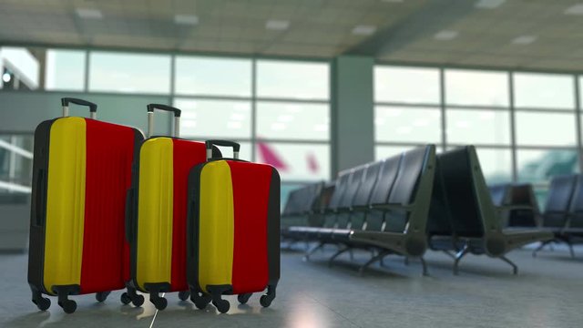 Travel suitcases featuring flag of Germany. German tourism conceptual animation