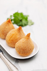 Brazilian snack coxinha de frango on dish