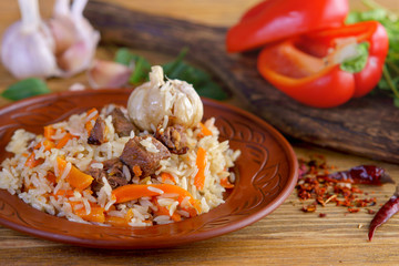Uzbek pilaf on wooden background