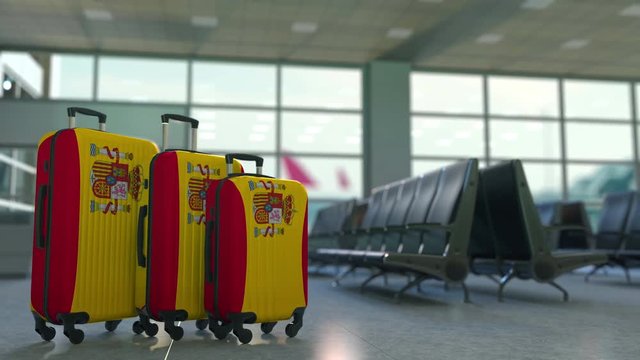 Travel suitcases featuring flag of Spain. Spanish tourism conceptual animation