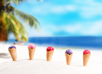 Ice cream, Ice cream berry scoops in waffle cone on beach sand. Summer concept with ice cream 