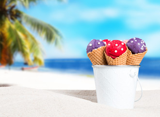 Ice cream, Ice cream berry scoops in waffle cone on beach sand. Summer concept with ice cream 