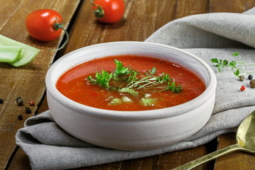 Gazpacho and ingredients on a table, vegetable soup. Delicious Spanish vegan cuisine. Close-up[ shot.