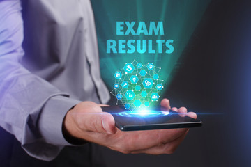 The concept of business, technology, the Internet and the network. A young entrepreneur working on a virtual screen of the future and sees the inscription: Exam results