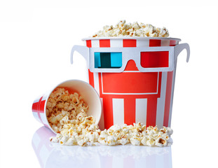 Large bucket and small cup of appetizing salty popcorn with 3d anaglyph glasses