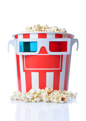 Fototapeta premium Large bucket of appetizing salty popcorn with 3d anaglyph glasses