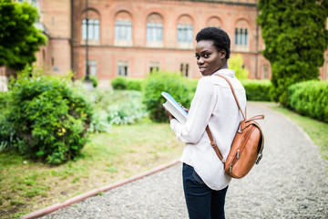 Obraz premium Time to get knowledge. Beautiful female african american university student portrait