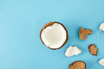 top view of arranged coconut pieces isolated on blue