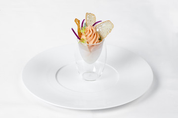 Exquisite fish mousse in a glass goblet.