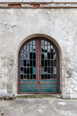 Fototapeta na wymiar Vintage door with broken windows