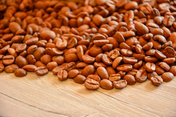 Coffee grains scattered on a light surface