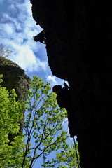 Hikers in a dangerous pathway - via ferrata in the mountain resort Skalka in Kremnica mountains- Europe, country Slovakia. Extreme hiking and climbing concept. 