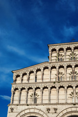 Fototapeta premium Lucca Cathedral beautiful medieval facade, erected in the 13th century (with clouds and copy space)