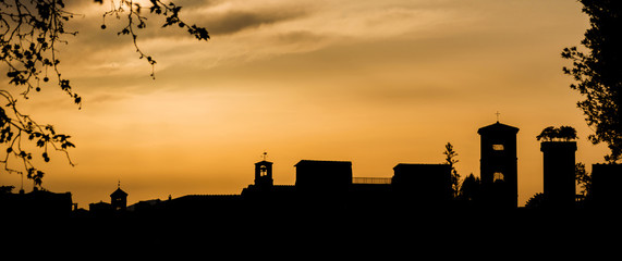 Lucca golden sunset skyline with ancient medieval towers - obrazy, fototapety, plakaty