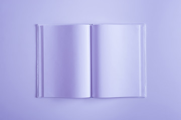 elevated view of one violet opened copybook isolated on violet