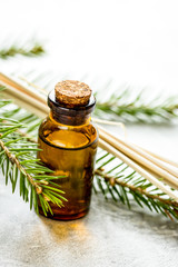 aromatherapy with organic spruce oils in glass bottles on white 